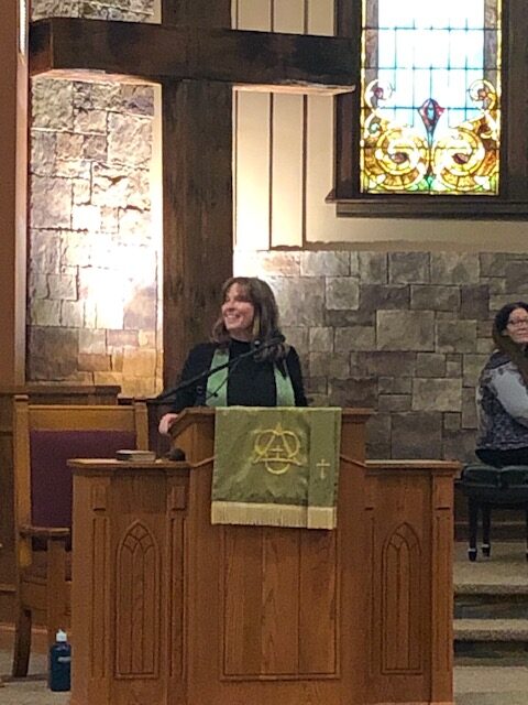 Pastor KJ at the pulpit far