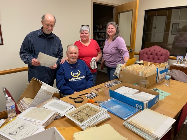 People studying old documents
