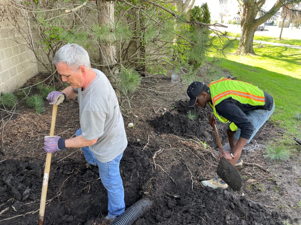 Scott and Clinton digging