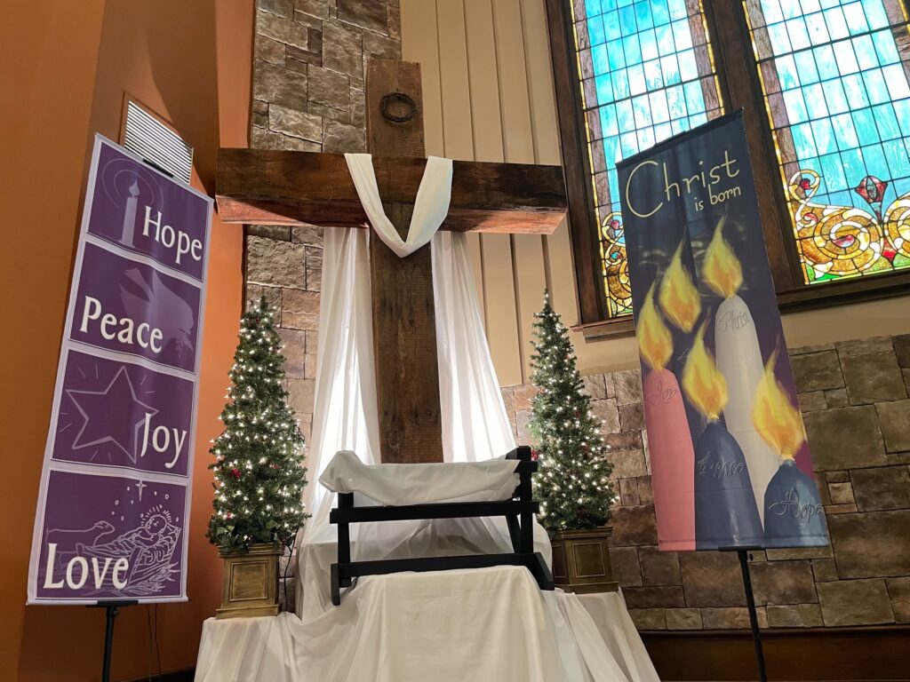 The Cross at Christmas with Hope, Peace, Love Banner