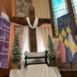 The Cross at Christmas with Hope, Peace, Love Banner