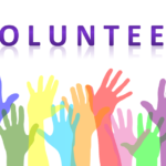 Image of many hands raised and the word volunteer, pixabay