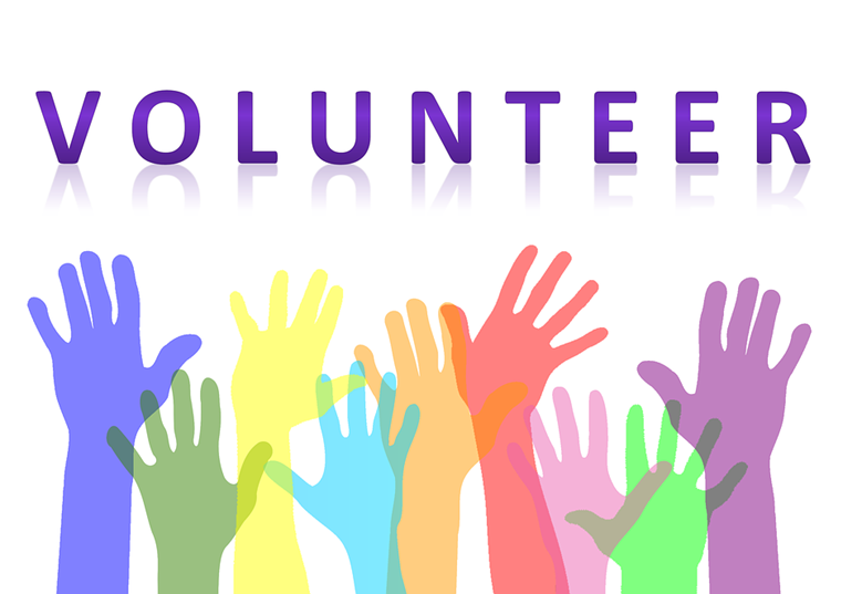 Image of many hands raised and the word volunteer, pixabay