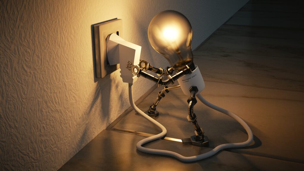 a fictional image of a lightbulb pluging itself in, pixabay