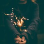 person holding a sparkler, pixabay