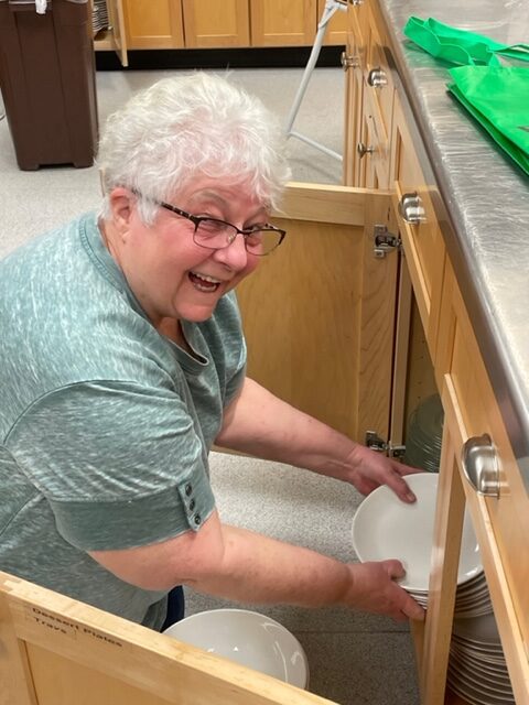 Linda cleaning kitchen