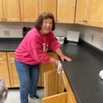 Ruth cleaning kitchen