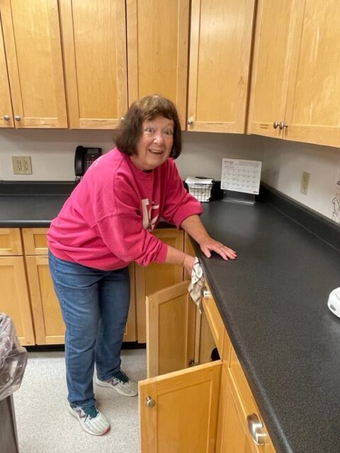 Ruth cleaning kitchen