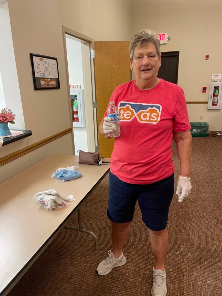 Debbie cleaning the Fellowship Hall