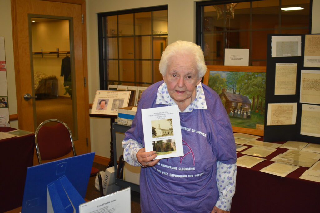 Librarian Nancy Hackett holding 190th book