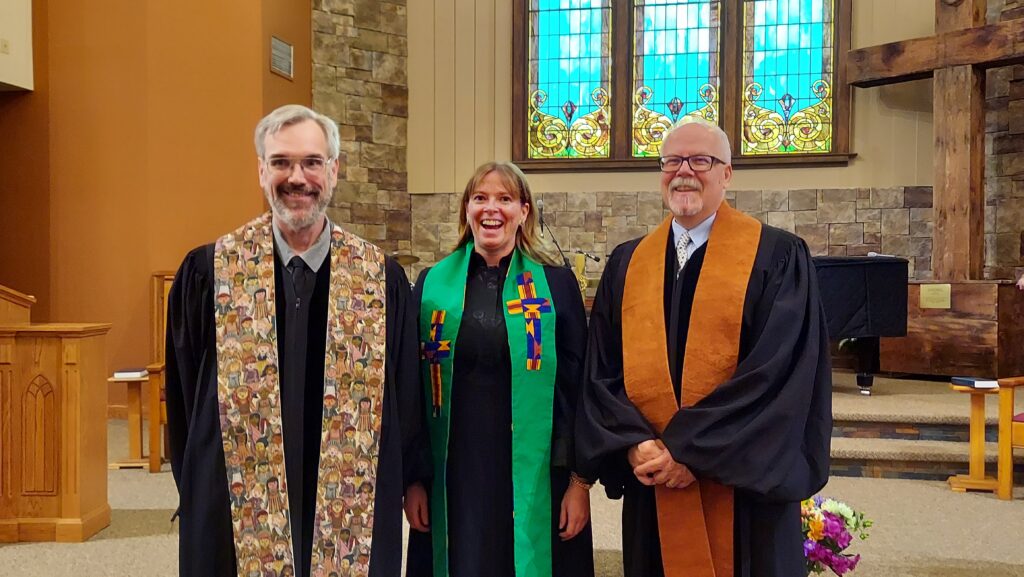 Pastors Ted, KJ, and Eric in front of church