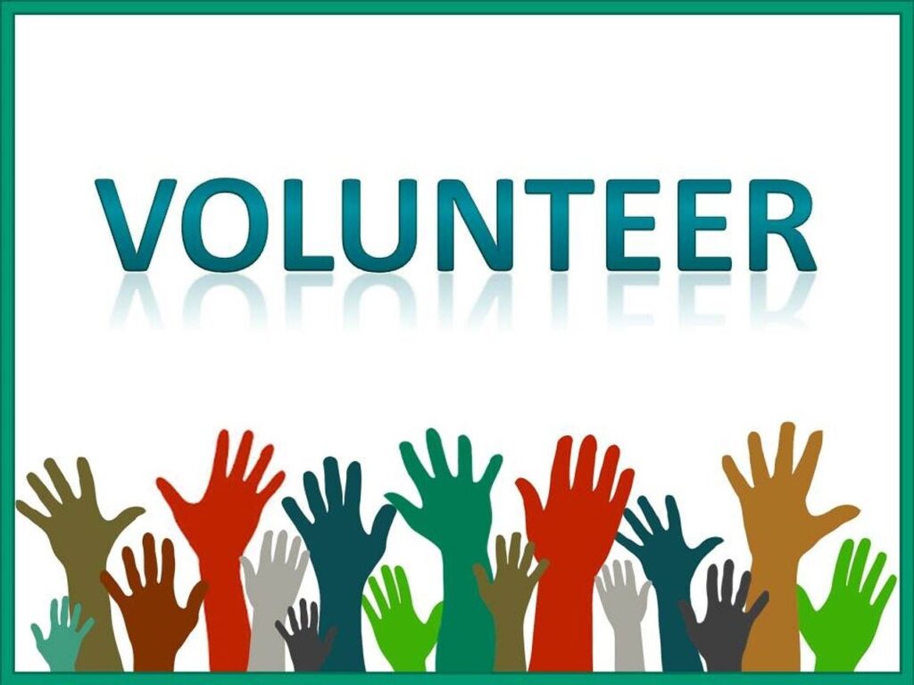 the word "volunteer" and hands in the air, pixabay
