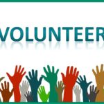 the word "volunteer" and hands in the air, pixabay