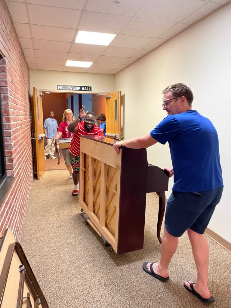 Stewards moving pianos