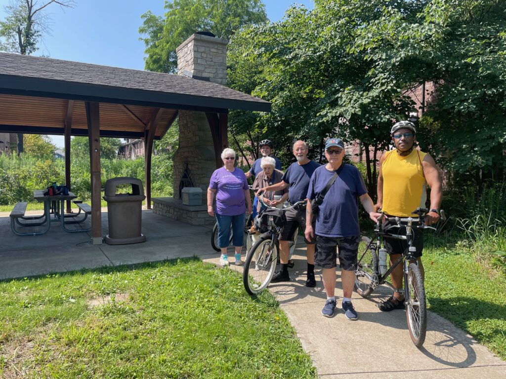 Group of Walkers and Bikers in July