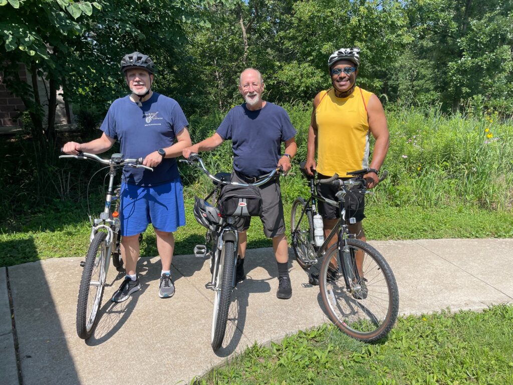 Three men participating on July Bike