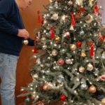 John Decorating the Christmas Tree