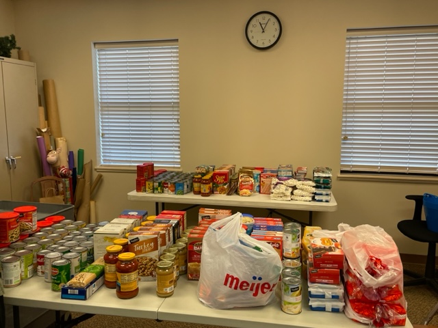 Two tables of full of food for donation