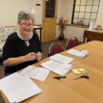 Deb signing papers