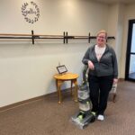 Katrina cleaning the carpet