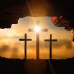 Three crosses seen through an open cave