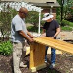 Georges and Jim creating the raised garden beds