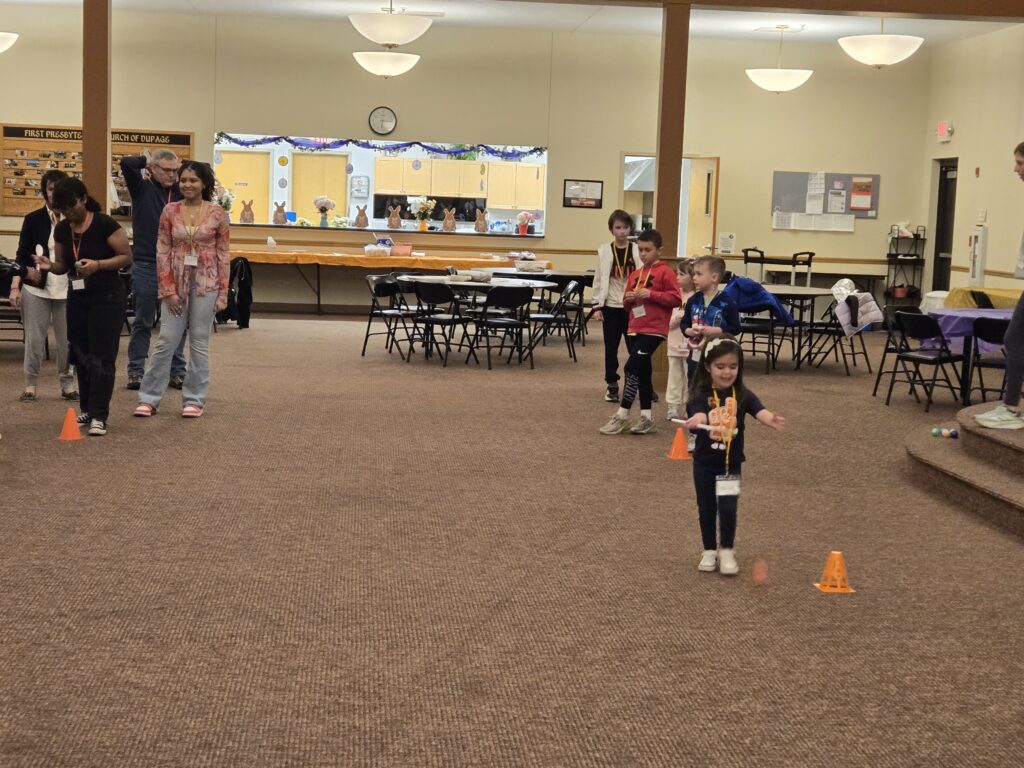 Kids vs leaders relay race balancing eggs!